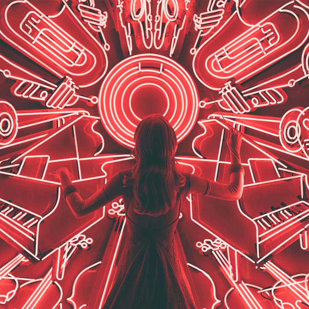 Person in Front of Neon Lights Panteoncito School